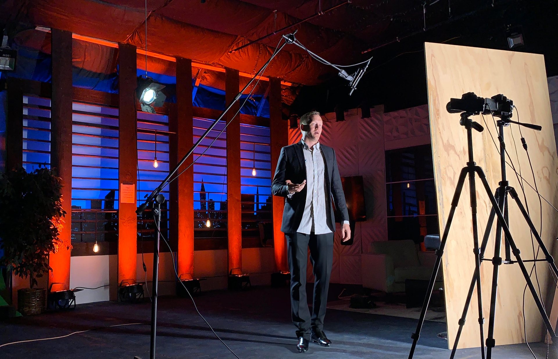 Strange Normal crew filming on location with studio lighting and cameras